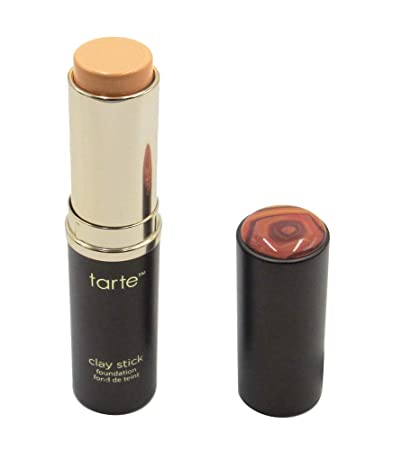 makeup stick foundation with its cap on the right