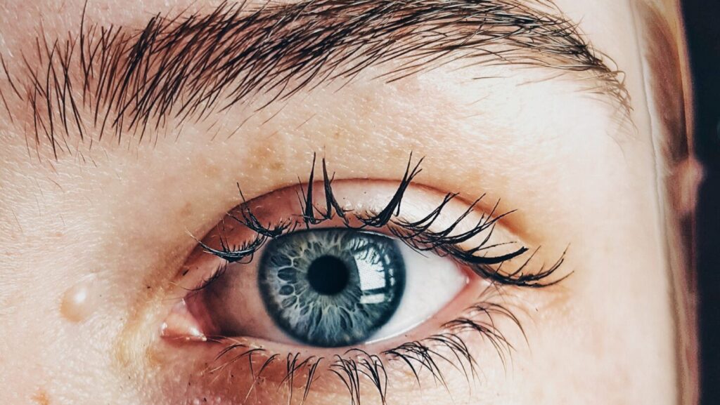 woman with blue eyes looking into the camera