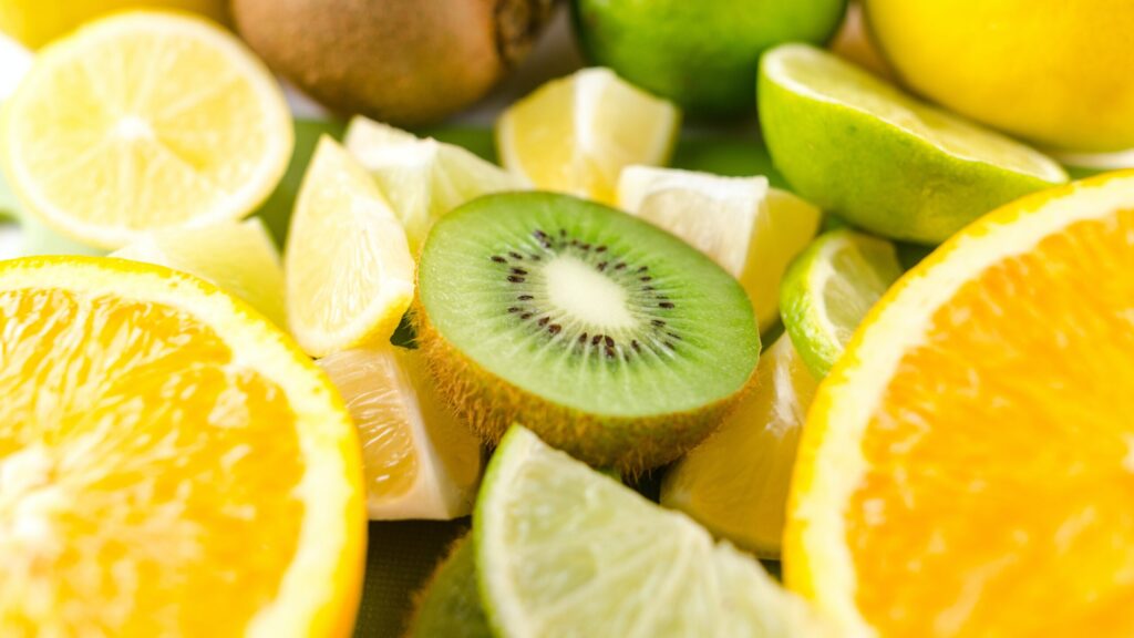 kiwis and oranges that boost vitamin c arranged in an aesthetic order