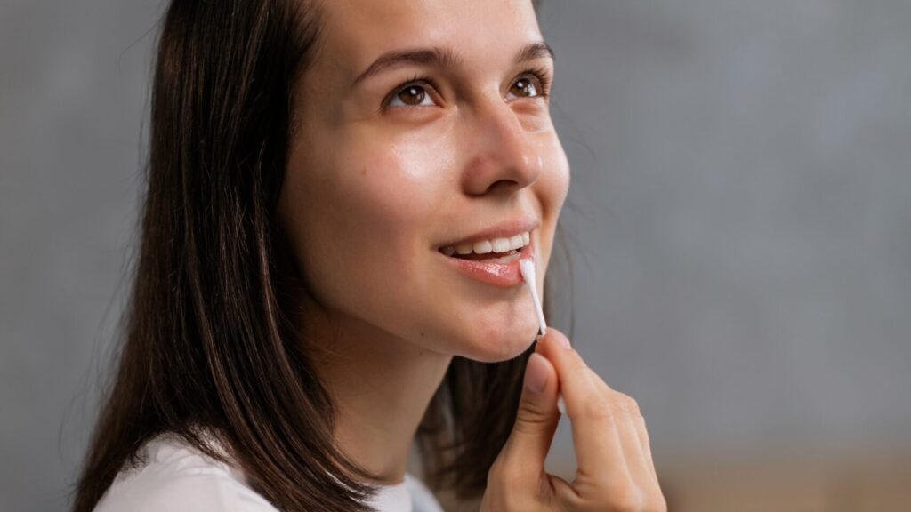 a woman posing for a camera as she smiles