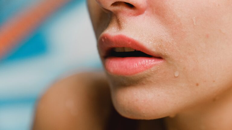 close up of a woman in pool with moisturized lips