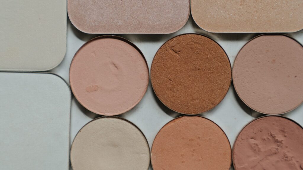 eyeshadow palettes of different shades placed on a white background.