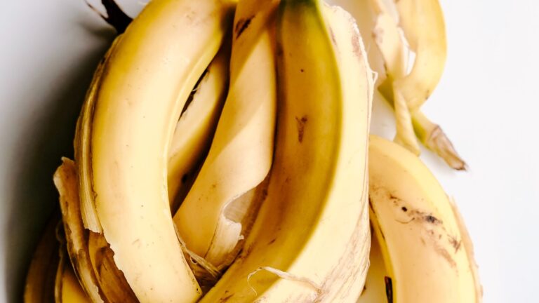 banana peel that help with open pores placed on a grey surface.