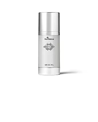 a silver bottle of skinmedica gold serum