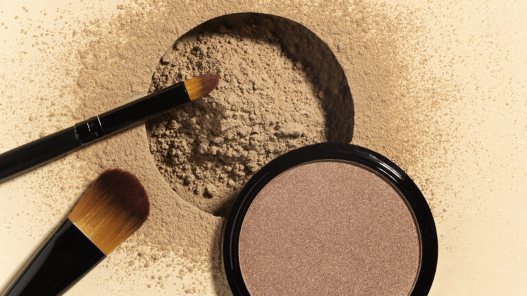 stippling makeup brush picking up nude face powder