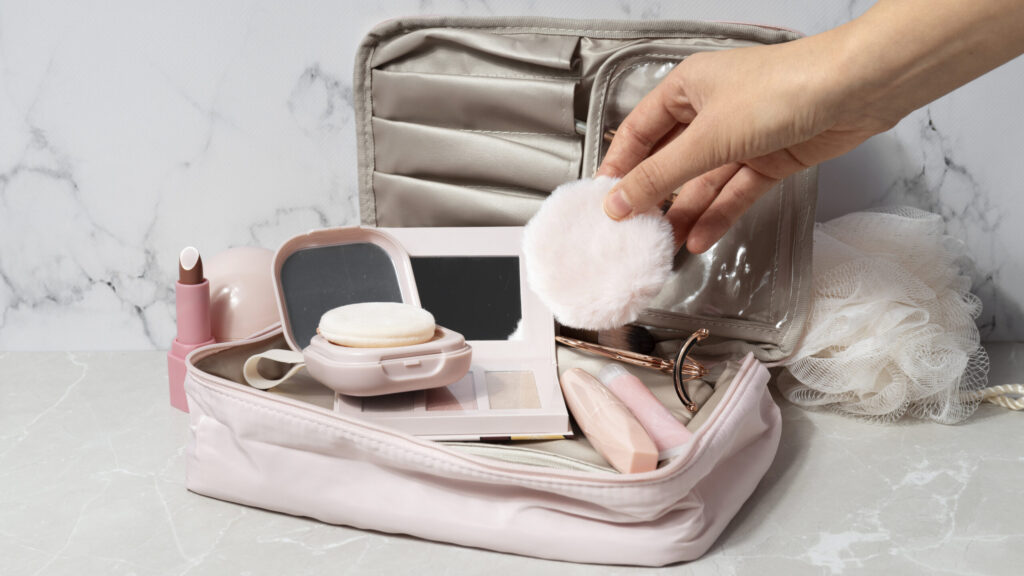 cosmetic traveling bag with makeup inside it